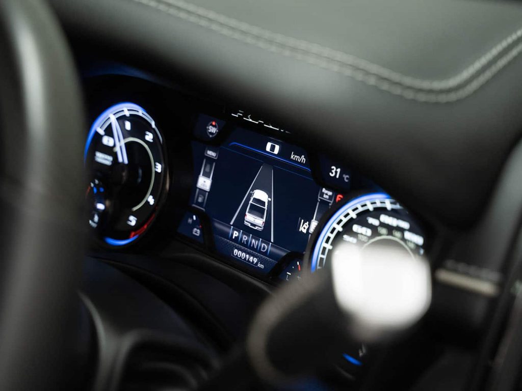 A close-up of the RAM 3500 Laramie HO's dashboard, showing the driver assist technology.